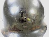 a close up of a helmet with a hole in it