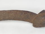 a close up of a metal object on a white surface
