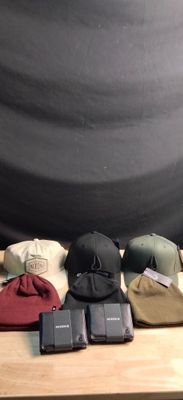a table with a bunch of hats on top of it