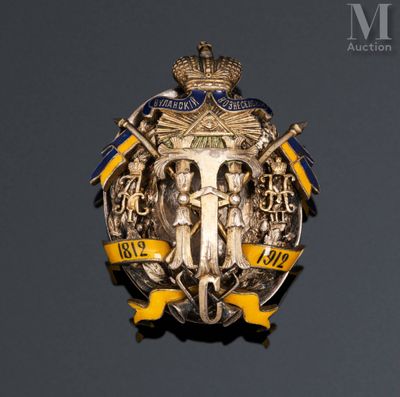 a badge on the wall of a building with a crown on top of it