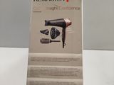 packaging of a hair dryer sitting on top of a white table