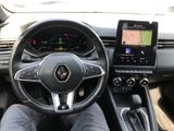 the interior of a car with a steering wheel and a touch screen
