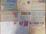 several old envelopes are sitting on top of a wooden table