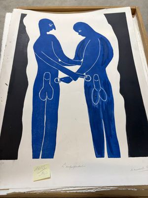 une photo montrant deux hommes se serrant la main dans un encadré