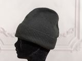 a black mannequin head with a hat on it