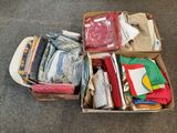 a box full of clothes sitting on the floor
