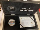 a box with a medal and a certificate in it