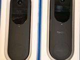 two black and white electronic devices in a blue box on the floor