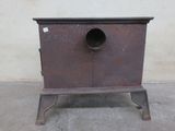 a small metal cabinet with a hole in it