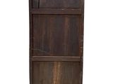 an old wooden bookcase with a door on top of it