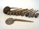 a lot of nails and a pair of scissors on the table