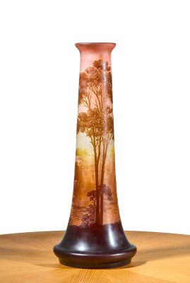 a vase that has a picture of a tree on it