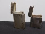 two lighters that are sitting next to each other on a table