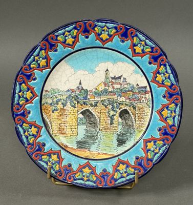 a plate with a picture of a bridge on it