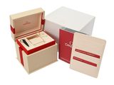 three boxes with a watch and a card holder in them