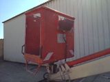 a red box sitting on top of a metal cart