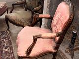 two chairs that are sitting in front of a fire place