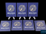 four blue playing cards with one piece and one piece on them