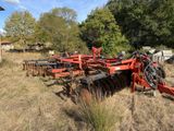 an image of a tractor plow in a field