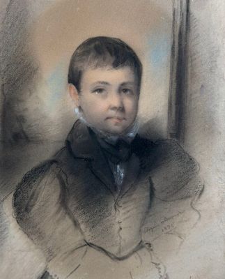 portrait of a young boy in a black suit and bow tie