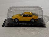 a yellow car in a glass case on a white surface
