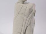 a statue of a man wrapped in a blanket on a white background