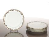 three plates sitting on a table next to each other