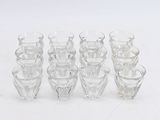 a lot of glasses that are sitting on a table