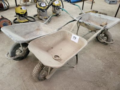 two wheelbarrows and a wheelbarrow on the ground