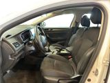the interior of a car with the door open and the driver ' s seat down