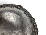 a silver plate that is sitting on a table