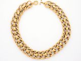 an image of a gold chain bracelet on a white background