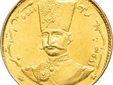 a close up of a gold coin with an image of a man wearing a hat