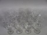 many empty wine glasses sitting on a white table
