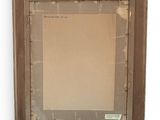 an old picture frame with a piece of paper taped to it