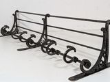 a metal rack that has a bunch of shoes on it