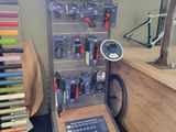 a bike shop with many different tools on the wall