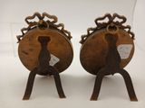 pair of antique brass candlesticks with lion heads on them