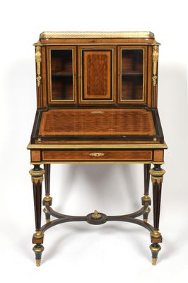 an antique writing desk with a wooden top and brass trimmings