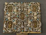an image of a box that has some kind of jewelry on it