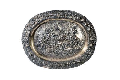 an image of a silver plate with a picture of a man on a horse