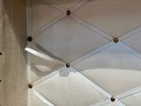 a picture of a white wall with a pin board attached to it