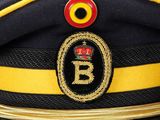 a close up of a hat with a crown on it