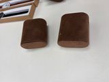 two rolls of toilet paper sitting on a table next to a pair of scissors