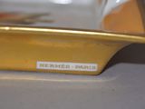a yellow bowl with a label on it on a table