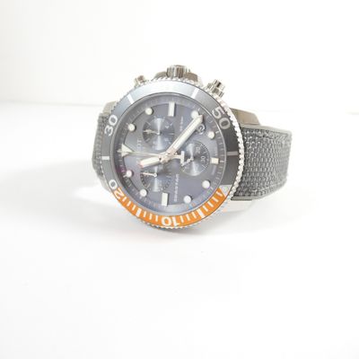 a watch that is sitting on a white surface