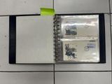 a notepad with a picture of a train on it sitting on a tile floor
