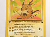 a close up of a pokemon card on a white surface
