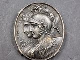 une pièce d'argent à l'effigie d'un homme portant un casque