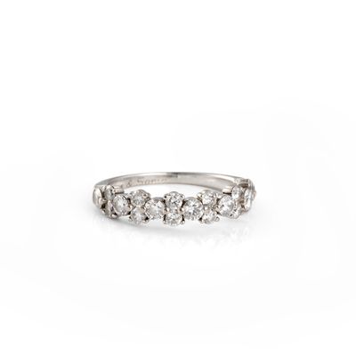 a close up of a diamond ring on a white background